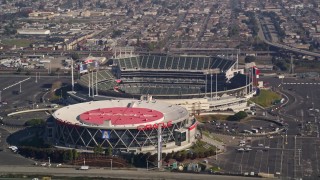 AXSF05_090 - 5K aerial stock footage flying by O.co Coliseum and the Oracle Arena, Oakland, California