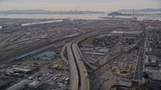 AXSF06_007 - 5K aerial stock footage fly over I-880 freeway approaching the Port of Oakland, California
