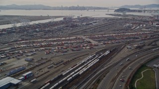 AXSF06_008 - 5K aerial stock footage tilt from I-880 freeway, revealing the Port of Oakland, California