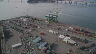 AXSF06_011 - 5K aerial stock footage of cargo cranes and containers at the Port of Oakland, California
