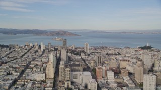 AXSF06_024 - 5K aerial stock footage pan across Nob Hill, Russian Hill apartment and office buildings to reveal Coit Tower and Downtown San Francisco, California