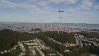 AXSF06_039 - 5K aerial stock footage flyby Sutro Tower to focus on Downtown San Francisco, California in the distance