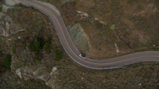 AXSF06_055 - 5K aerial stock footage track silver convertible on Highway 1, Marin County, California