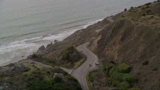 AXSF06_056 - 5K aerial stock footage of tracking a silver convertible traveling on Highway 1, Marin County, California