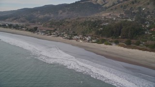 AXSF06_057 - 5K aerial stock footage of flying by beachside homes, Stinson Beach, California