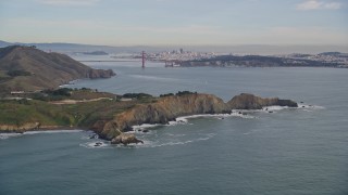 AXSF06_073 - 5K aerial stock footage tilt from Marin Headlands revealing Golden Gate Bridge, San Francisco, California