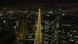 AXSF07_008 - 5K aerial stock footage of flying over Market Street past skyscrapers in Downtown San Francisco, California, night