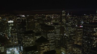 AXSF07_016 - 5K aerial stock footage tilt from The Embarcadero, reveal and fly over skyscrapers, Downtown San Francisco, California, night