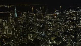 AXSF07_019 - 5K aerial stock footage of tilting from Chinatown to reveal skyscrapers in Downtown San Francisco, California, night