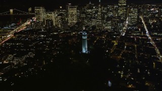 AXSF07_025 - 5K aerial stock footage flyby Coit Tower in North Beach, San Francisco, California, night