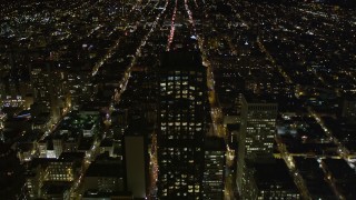 AXSF07_035 - 5K aerial stock footage of approaching 555 California Street skyscraper, Downtown San Francisco, California, night