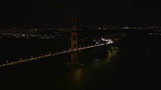 AXSF07_042 - 5K aerial stock footage of flying by the iconic Golden Gate Bridge, San Francisco, California, night