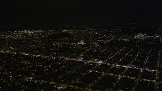 AXSF07_048 - 5K aerial stock footage approach St. Ignatius Church, Inner Richmond District, San Francisco, California, night