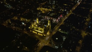 AXSF07_050 - 5K aerial stock footage tilt to reveal and orbit St. Ignatius Church in the Inner Richmond District, San Francisco, California, night