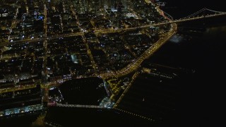 AXSF07_075 - 5K aerial stock footage of tilting from AT&T Park to reveal skyscrapers in Downtown San Francisco, California, night