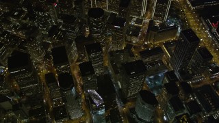 AXSF07_077 - 5K aerial stock footage tilt to bird's eye view of downtown skyscrapers around Market Street, San Francisco, California, night