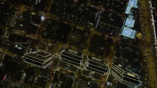 AXSF07_078 - 5K aerial stock footage of a bird's eye view of Embarcadero Center skyscrapers, Downtown San Francisco, California, night