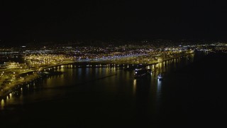 AXSF07_086 - 5K aerial stock footage of panning across the Port of Oakland, California, night