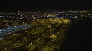 AXSF07_087 - 5K aerial stock footage video of flying over rows of containers at the Port of Oakland, California, night