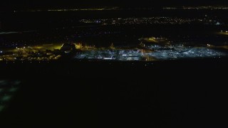 AXSF07_099 - 5K aerial stock footage of flying by Oakland International Airport, Oakland, California, night
