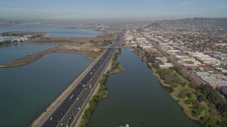 AXSF08_002 - 5K aerial stock footage of flying over Interstate 80 freeway and Aquatic Park, Berkeley, California