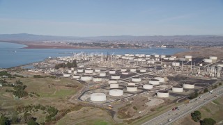 AXSF08_014 - 5K aerial stock footage of approaching ConocoPhillips Oil Refinery, Rodeo, California