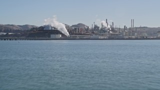 AXSF08_021 - 5K aerial stock footage of flying over San Pablo Bay, reveal ConocoPhillips Oil Refinery, Rodeo, California
