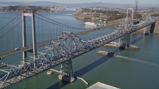 AXSF08_029 - 5K aerial stock footage of flying by both spans of the Carquinez Bridge, Carquinez Strait, Vallejo, California