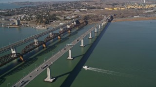 AXSF08_047 - 5K aerial stock footage tilt from yacht near bridges to wider view of Carquinez Strait and Benicia-Martinez Bridge, California