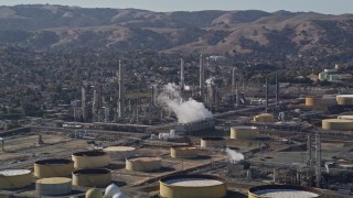 AXSF08_051 - 5K aerial stock footage of flying by Shell Oil Refinery buildings, Martinez, California
