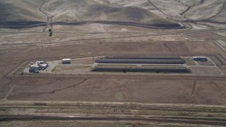 AXSF08_061 - 5K aerial stock footage of flying by the Port Chicago weapons depot, Bay Point, California