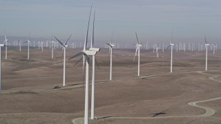 AXSF08_069 - 5K aerial stock footage of flying by windmills at Shiloh Wind Power Plant, Montezuma Hills, California