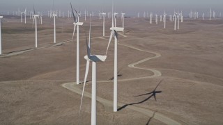 AXSF08_070 - 5K aerial stock footage of flying close to a windmill at Shiloh Wind Power Plant, Montezuma Hills, California
