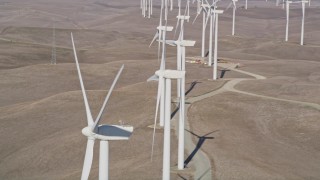 AXSF08_072 - 5K aerial stock footage of flying by windmills at Shiloh Wind Power Plant, Montezuma Hills, California
