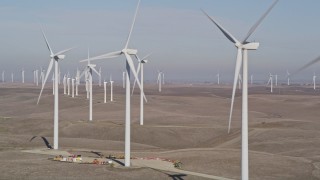 AXSF08_073 - 5K aerial stock footage of flying by rows of windmills, Shiloh Wind Power Plant, Montezuma Hills, California