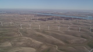 AXSF08_080 - 5K aerial stock footage of flying by field of windmills, Shiloh Wind Power Plant, Montezuma Hills, California