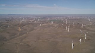 AXSF08_081 - 5K aerial stock footage of hilly field of windmills, Shiloh Wind Power Plant, Montezuma Hills, California
