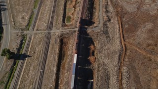 AXSF08_091 - 5K aerial stock footage of tracking a train traveling through Pittsburg, California