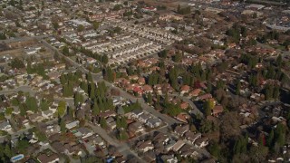 AXSF09_001 - 5K aerial stock footage of a reverse view of tract homes in a suburban neighborhoods, Pleasant Hill, California