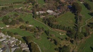 AXSF09_003 - 5K aerial stock footage of a reverse view of Contra Costa Golf Club, reveal apartment buildings Pleasant Hill, California