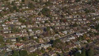 AXSF09_005 - 5K aerial stock footage of a reverse view of tract homes in residential neighborhoods, Martinez, California
