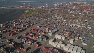 AXSF09_023 - 5K aerial stock footage flyby shipping containers at the Port of Oakland, California