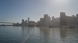 AXSF09_055 - 5K aerial stock footage fly by Downtown San Francisco, seen from low over the Bay, California