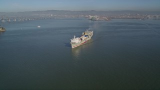 AXSF09_057 - 5K aerial stock footage of tracking a cargo ship sailing the San Francisco Bay, San Francisco, California