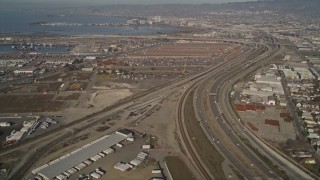 AXSF09_067 - 5K aerial stock footage of flying by I-880 freeway by urban neighborhoods, Oakland, California