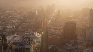 AXSF10_016 - 5K aerial stock footage follow Market Street through downtown with a hazy sunset, Downtown San Francisco, California