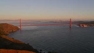 AXSF10_046 - 5K aerial stock footage of flying over Marin Hills, reveal Golden Gate Bridge in San Francisco, California, sunset