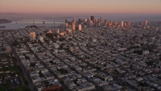 AXSF10_056 - 5K aerial stock footage of approaching Russian Hill and Downtown San Francisco skyscrapers, California, sunset