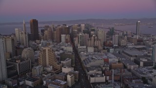 AXSF10_075 - 5K aerial stock footage of flying over Market Street through Downtown San Francisco, California, twilight