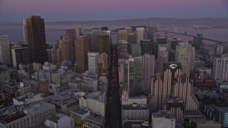 AXSF10_076 - 5K aerial stock footage tilt from Market Street to reveal and approach Downtown San Francisco, California, twilight
